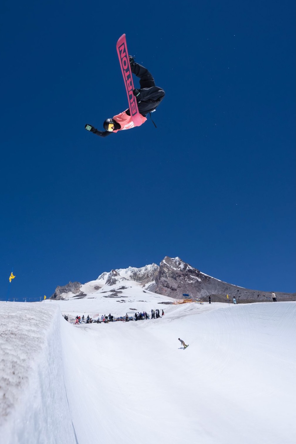 Jonas Hasler sliding a snowboard rail in the terrain park